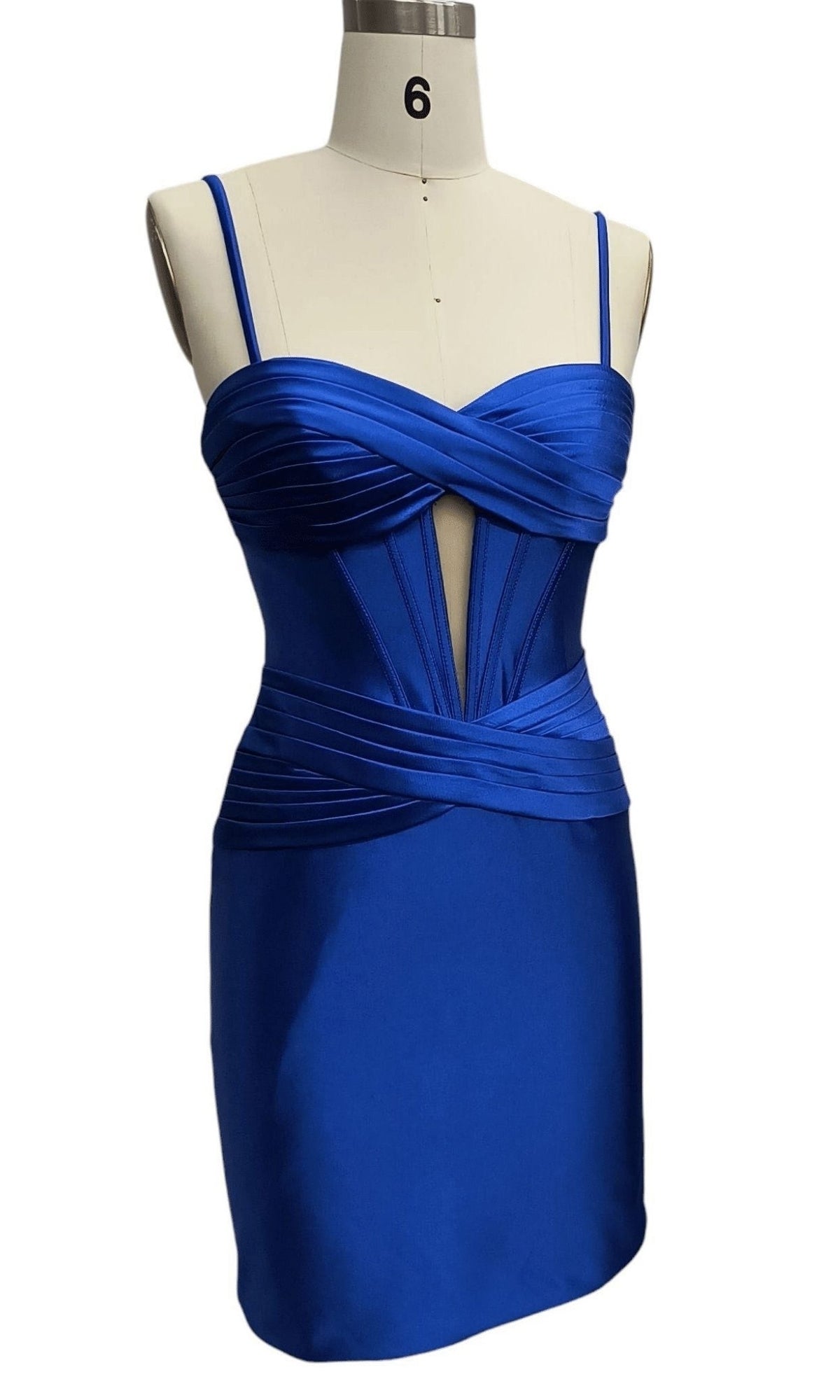 The Dave & Johnny 12306 Short Satin Corset Hoco Dress in royal blue features thin straps, a sweetheart neckline, corset-style bodice details, and a fitted mini silhouette on a dress form.